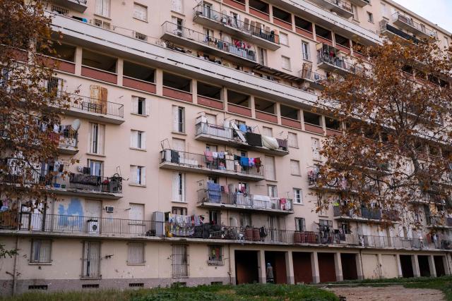 This photograph shows buildings of the "La Cite des Rosiers" residential complex, in the Sainte Marthe neighborhood, northern Marseille, on December 9, 2025. (Photo by Miguel MEDINA / AFP)