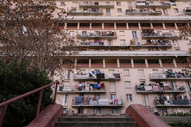 This photograph shows buildings of the "La Cite des Rosiers" residential complex, in the Sainte Marthe neighborhood, northern Marseille, on December 9, 2025. (Photo by Miguel MEDINA / AFP)