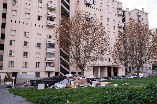 This photograph shows buildings of the "La Cite des Rosiers" residential complex, in the Sainte Marthe neighborhood, northern Marseille, on December 9, 2025. (Photo by Miguel MEDINA / AFP)