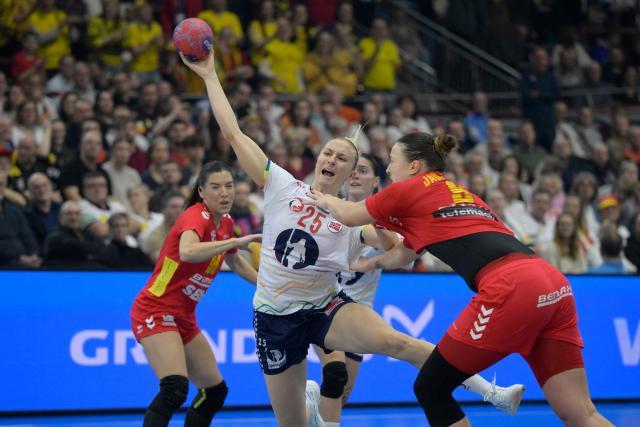 Norway's centre back #25 Henny Ella Reistad and Sporting Lisbon's Danish forward #09 Conrad Harder vie for the ball during the quarter final match between Norway and Montenegro of the IHF Women's Handball World Championship in Dortmund, western Germany on December 9, 2025. (Photo by Sascha Schuermann / AFP)