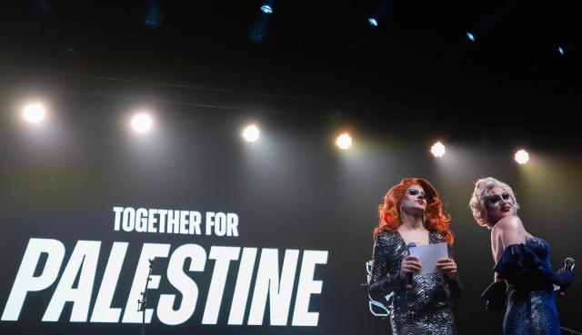 French Drag Queen duo, Rose and Punani, perform on stage during a "Together for Palestine" benefit concert at the Zenith Paris event venue, in Paris on December 9, 2025. (Photo by Anna KURTH / AFP)