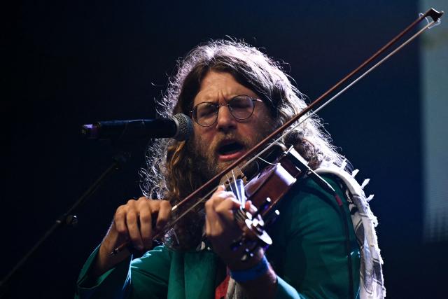 Elik Harpaz performs on stage during a "Together for Palestine" benefit concert at the Zenith Paris event venue, in Paris on December 9, 2025. (Photo by Anna KURTH / AFP)