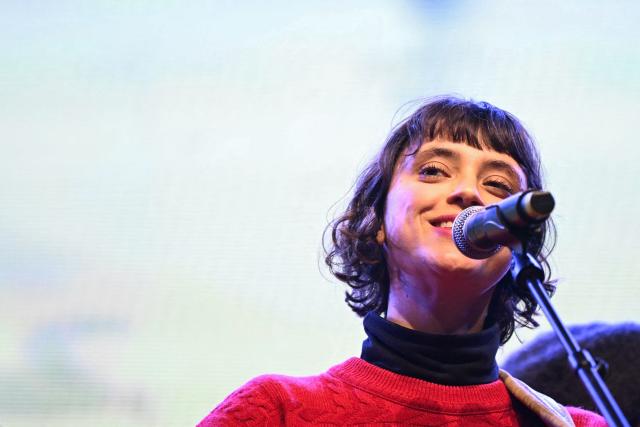 French singer Claire Pommet, aka Pomme, performs during a "Together for Palestine" benefit concert at the Zenith Paris event venue, in Paris on December 9, 2025. (Photo by Anna KURTH / AFP)