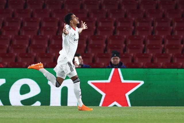 Frankfurt's German forward #07 Ansgar Knauff celebrates scoring his team's first goal during the UEFA Champions League league phase day 6 football match between FC Barcelona and Eintracht Frankfurt at Camp Nou Stadium in Barcelona on December 9, 2025. (Photo by Josep LAGO / AFP)