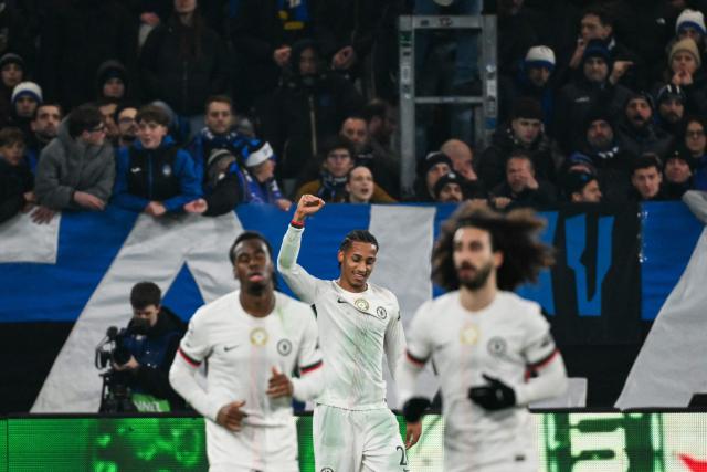 Chelsea's Brazilian striker #20 Joao Pedro (C) celebrates with teammates after scoring his team's first goal during the UEFA Champions League league phase day 6 football match between Atalanta Bergamo and Chelsea FC at Bergamo Stadium, in Bergamo, on December 9, 2025. (Photo by Alberto PIZZOLI / AFP)