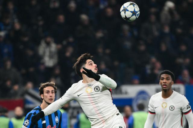 Chelsea's Portuguese midfielder #07 Pedro Neto eyes the ball during the UEFA Champions League league phase day 6 football match between Atalanta Bergamo and Chelsea FC at Bergamo Stadium, in Bergamo, on December 9, 2025. (Photo by Alberto PIZZOLI / AFP)