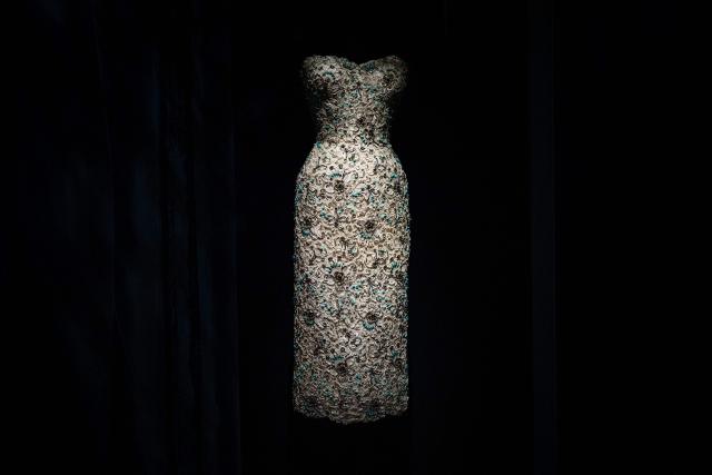 This photograph shows a dress by Christian Dior displayed at the exhibition "Azzedine Alaia and Christian Dior, Two Masters of Haute Couture" from the Azzedine Alaia Foundation at La Galerie Dior in Paris, on December 9, 2025. The exhibition will run untill May 3, 2026. (Photo by Dimitar DILKOFF / AFP)