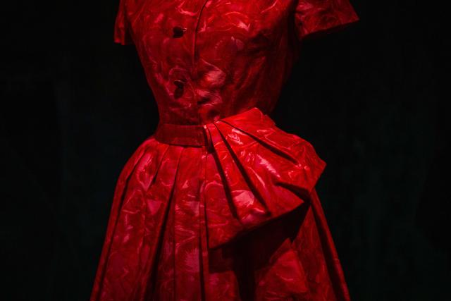 This photograph shows a dress by Christian Dior displayed at the exhibition "Azzedine Alaia and Christian Dior, Two Masters of Haute Couture" from the Azzedine Alaia Foundation at La Galerie Dior in Paris, on December 9, 2025. The exhibition will run untill May 3, 2026. (Photo by Dimitar DILKOFF / AFP)