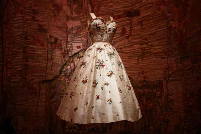 This photograph shows a dress by Christian Dior displayed at the exhibition "Azzedine Alaia and Christian Dior, Two Masters of Haute Couture" from the Azzedine Alaia Foundation at La Galerie Dior in Paris, on December 9, 2025. The exhibition will run untill May 3, 2026. (Photo by Dimitar DILKOFF / AFP)