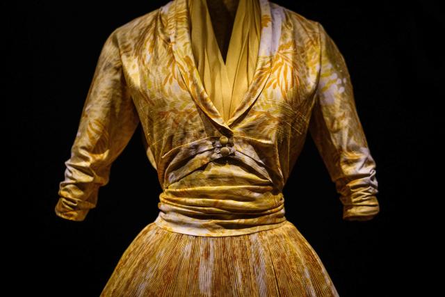 This photograph shows a dress by Christian Dior displayed at the exhibition "Azzedine Alaia and Christian Dior, Two Masters of Haute Couture" from the Azzedine Alaia Foundation at La Galerie Dior in Paris, on December 9, 2025. The exhibition will run untill May 3, 2026. (Photo by Dimitar DILKOFF / AFP)