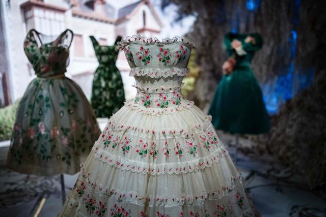 This photograph shows dresses by Christian Dior displayed at the exhibition "Azzedine Alaia and Christian Dior, Two Masters of Haute Couture" from the Azzedine Alaia Foundation at La Galerie Dior in Paris, on December 9, 2025. The exhibition will run untill May 3, 2026. (Photo by Dimitar DILKOFF / AFP)