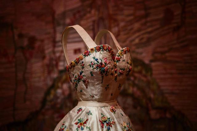 This photograph shows a dress by Christian Dior displayed at the exhibition "Azzedine Alaia and Christian Dior, Two Masters of Haute Couture" from the Azzedine Alaia Foundation at La Galerie Dior in Paris, on December 9, 2025. The exhibition will run untill May 3, 2026. (Photo by Dimitar DILKOFF / AFP)