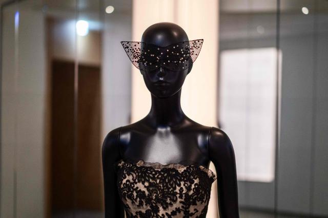 This photograph shows a dress by Christian Dior on a mannequin displayed at the exhibition "Azzedine Alaia and Christian Dior, Two Masters of Haute Couture" from the Azzedine Alaia Foundation at La Galerie Dior in Paris, on December 9, 2025. The exhibition will run untill May 3, 2026. (Photo by Dimitar DILKOFF / AFP)