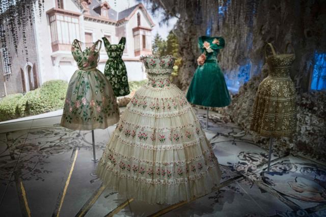 This photograph shows dresses by Christian Dior displayed at the exhibition "Azzedine Alaia and Christian Dior, Two Masters of Haute Couture" from the Azzedine Alaia Foundation at La Galerie Dior in Paris, on December 9, 2025. The exhibition will run untill May 3, 2026. (Photo by Dimitar DILKOFF / AFP)