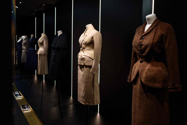 This photograph shows creations by Christian Dior displayed at the exhibition "Azzedine Alaia and Christian Dior, Two Masters of Haute Couture" from the Azzedine Alaia Foundation at La Galerie Dior in Paris, on December 9, 2025. The exhibition will run untill May 3, 2026. (Photo by Dimitar DILKOFF / AFP)