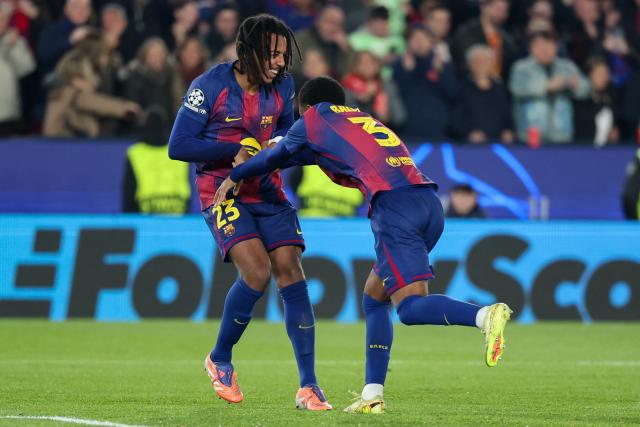 Barcelona's French defender #23 Jules Kounde (L) celebrates scoring his team's second goal with Barcelona's Spanish defender #03 Alex Balde during the UEFA Champions League league phase day 6 football match between FC Barcelona and Eintracht Frankfurt at Camp Nou Stadium in Barcelona on December 9, 2025. (Photo by Lluis GENE / AFP)