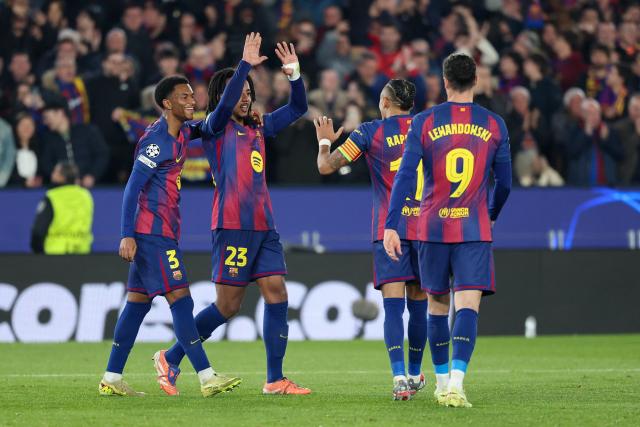 Barcelona's French defender #23 Jules Kounde (2L) celebrates scoring his team's second goal with Barcelona's Spanish defender #03 Alex Balde during the UEFA Champions League league phase day 6 football match between FC Barcelona and Eintracht Frankfurt at Camp Nou Stadium in Barcelona on December 9, 2025. (Photo by Lluis GENE / AFP)