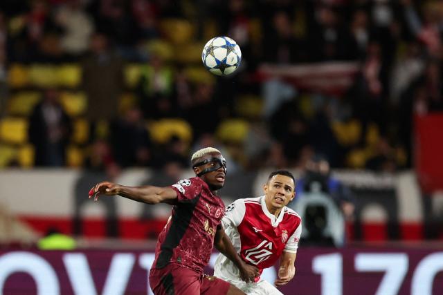 Galatasaray's Nigerian forward #45 Victor Osimhen (L) fights for the ball with Monaco's Brazilian defender #02 Vanderson during the UEFA Champions League, league phase, football match between Monaco and Galatasaray, at the Stade Louis II stadium, in Monaco, on December 9, 2025. (Photo by Valery HACHE / AFP)