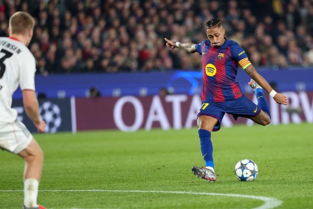 Barcelona's Brazilian forward #11 Raphinha shoots at goal during the UEFA Champions League league phase day 6 football match between FC Barcelona and Eintracht Frankfurt at Camp Nou Stadium in Barcelona on December 9, 2025. (Photo by Lluis GENE / AFP)