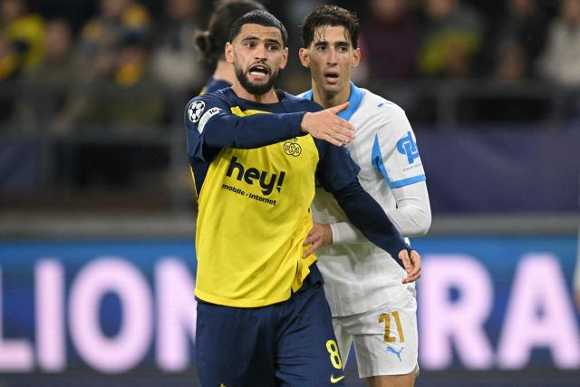 Union St-Gilloise's Algerian midfielder #08 Adem Zorgane reacts during the UEFA Champions League, league phase day 6, football match between Royale Union Saint-Gilloise (BEL) and Olympique de Marseille (FRA), at the RSC Anderlecht Stadium in Brussels, on December 9, 2025. (Photo by NICOLAS TUCAT / AFP)