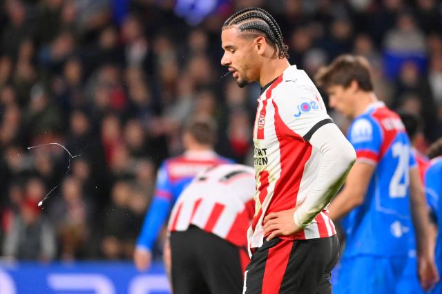 PSV Eindhoven's Dutch defender #04 Armando Obispo spits at the end of the UEFA Champions League, league phase day 6, football match between PSV Eindhoven (NED) and Atletico Madrid (ESP), at the Philips Stadion, in Eindhoven, south of The Netherlands, on December 9, 2025. (Photo by JOHN THYS / AFP)