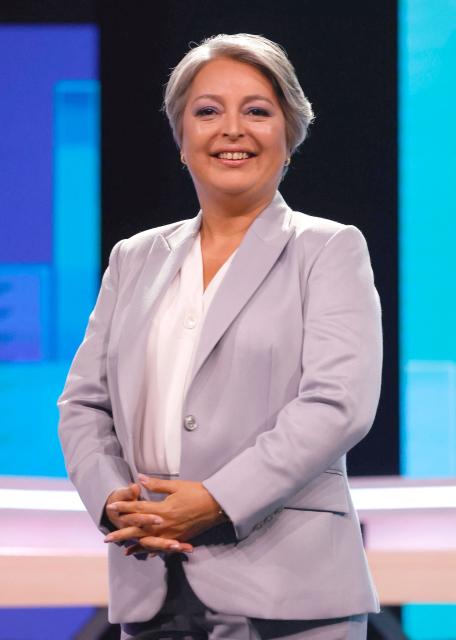 Chile's presidential candidate Jeannette Jara, of the Unidad por Chile coalition, smiles before a debate organized by the National Television Association in Santiago, on December 9, 2025. The second round of the Chilean presidential election on December 14, 2025, will pit two candidates who are totally opposed: Jeannette Jara, from a broad left-wing coalition with modest origins, and the far-right leader Jose Antonio Kast, an ultraconservative Catholic determined to massively expel undocumented migrants. (Photo by Raul BRAVO / AFP)
