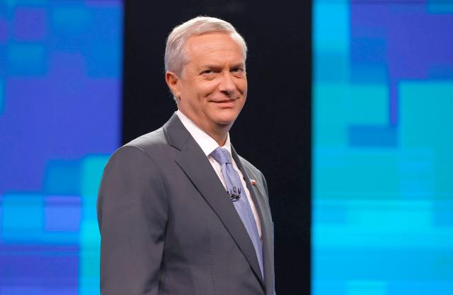 Chile's presidential candidate Jose Antonio Kast, of the Republicano party, smiles before a debate organized by the National Television Association in Santiago on December 9, 2025. The second round of the Chilean presidential election on December 14, 2025, will pit two candidates who are totally opposed: Jeannette Jara, from a broad left-wing coalition with modest origins, and the far-right leader Jose Antonio Kast, an ultraconservative Catholic determined to massively expel undocumented migrants. (Photo by Raul BRAVO / AFP)