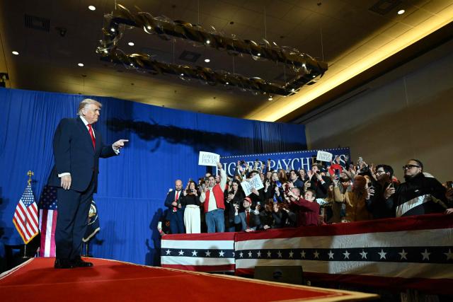 US President Donald Trump cheers the attendees upon his arrival to deliver remarks on the economy at Mount Airy Casino Resort in Mount Pocono, Pennsylvania, on December 9, 2025. (Photo by ANDREW CABALLERO-REYNOLDS / AFP)