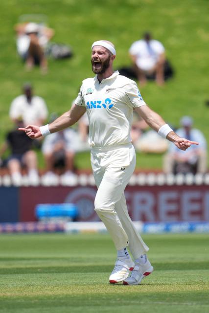 New Zealand Michael Rae celebrates West Indies John Campbell being caught during day one of the 2nd international Test cricket match between New Zealand and West Indies at the Basin reserve in Wellington on December 10, 2025. (Photo by Marty MELVILLE / AFP)
