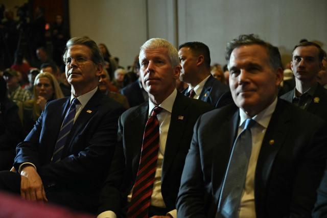 US Secretary of the Treasury Scott Bessent (L) and the Secretary of Energy Chris Wright (C) listen as US President Donald Trump deliver remarks on the economy at Mount Airy Casino Resort in Mount Pocono, Pennsylvania, on December 9, 2025. (Photo by ANDREW CABALLERO-REYNOLDS / AFP)