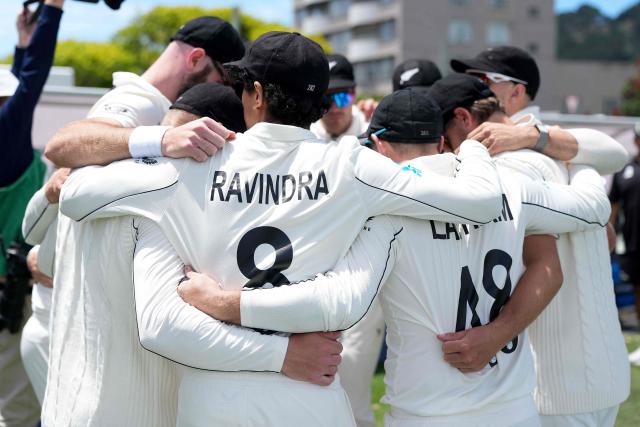 New Zealand players huddle after lunch during day one of the 2nd international Test cricket match between New Zealand and West Indies at the Basin reserve in Wellington on December 10, 2025. (Photo by Marty MELVILLE / AFP)