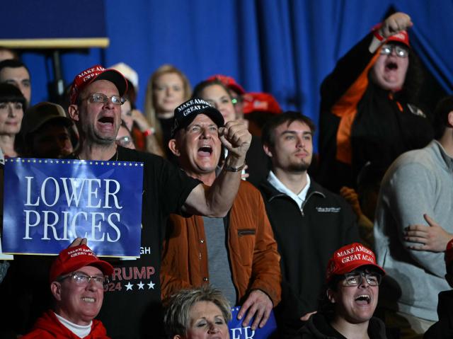 Attendees react as US President Donald Trump delivers remarks on the economy at Mount Airy Casino Resort in Mount Pocono, Pennsylvania, on December 9, 2025. (Photo by ANDREW CABALLERO-REYNOLDS / AFP)