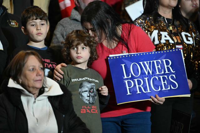 Attendees look on as US President Donald Trump delivers remarks on the economy at Mount Airy Casino Resort in Mount Pocono, Pennsylvania, on December 9, 2025. (Photo by ANDREW CABALLERO-REYNOLDS / AFP)