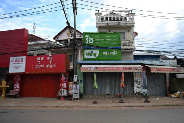Shops and houses are close in Oddar Meanchey province on December 10, 2025 following clashes along the Cambodia-Thailand border. Fighting between Thailand and Cambodia spread to more parts of their contested border on Tuesday, forcing a mass exodus of civilians as the renewed hostilities derailed a US-brokered truce. (Photo by TANG CHHIN Sothy / AFP)