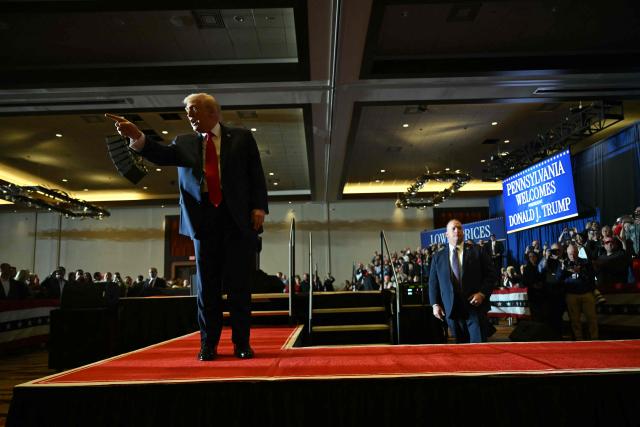 US President Donald Trump interacts with attendees after he delivered remarks on the economy at Mount Airy Casino Resort in Mount Pocono, Pennsylvania, on December 9, 2025. (Photo by ANDREW CABALLERO-REYNOLDS / AFP)