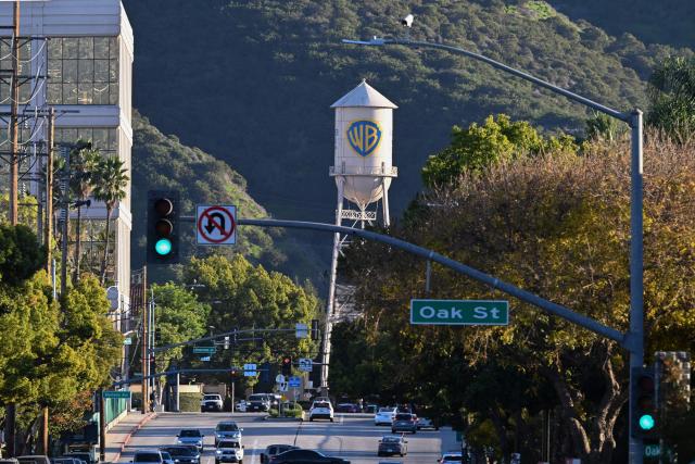 The WB water tower is seen at Warner Bros. Studios in Burbank, California, on December 9, 2025. Paramount on December 8 launched an all-cash tender offer to acquire Warner Bros. Discovery, the Hollywood giant that also owns CNN, in a challenge to Netflix's own highly contested deal. (Photo by Robyn Beck / AFP)