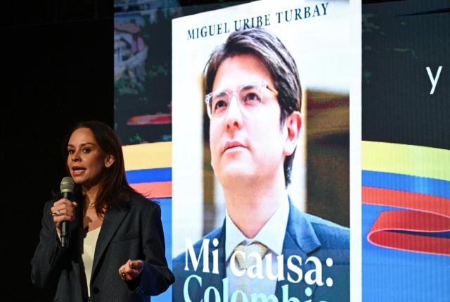 Maria Claudia Tarazona, widow of slain presidential hopeful and senator Miguel Uribe, speaks during the presentation of Uribe's autobiography "Mi Causa: Colombia" in Bogota on December 9, 2025. (Photo by Raul ARBOLEDA / AFP)