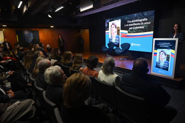 Maria Claudia Tarazona, widow of slain presidential hopeful and senator Miguel Uribe, speaks during the presentation of Uribe's autobiography "Mi Causa: Colombia" in Bogota on December 9, 2025. (Photo by Raul ARBOLEDA / AFP)
