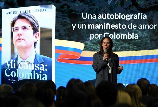 Maria Claudia Tarazona, widow of slain presidential hopeful and senator Miguel Uribe, speaks during the presentation of Uribe's autobiography "Mi Causa: Colombia" in Bogota on December 9, 2025. (Photo by Raul ARBOLEDA / AFP)
