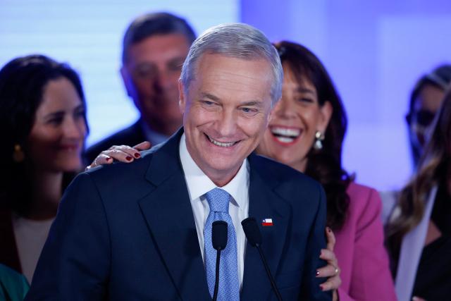 Chile's presidential candidate Jose Antonio Kast, of the Republicano party, smiles after a debate organized by the National Television Association in Santiago on December 9, 2025. The second round of the Chilean presidential election on December 14, 2025, will pit two candidates who are totally opposed: Jeannette Jara, from a broad left-wing coalition with modest origins, and the far-right leader Jose Antonio Kast, an ultraconservative Catholic determined to massively expel undocumented migrants. (Photo by Raul BRAVO / AFP)
