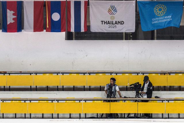 Flags of the participating nations of the 33rd Southeast Asian Games (SEA Games), including (L-R) Cambodia, Indonesia, Laos and Thailand, are displayed during the gymnastics event at Thammasat University Rangsit in Pathum Thani near Bangkok on December 10, 2025. (Photo by Chanakarn LAOSARAKHAM / AFP)