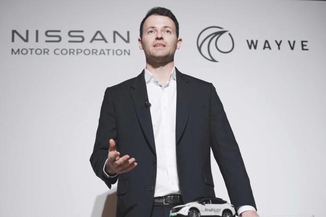 Wayve Technologies CEO Alex Kendall delivers a speech during a press conference before a signing ceremony with Nissan Motor CEO Ivan Espinosa for the collaboration agreement between the two companies regarding technologies for the ProPILOT next-generation driver assistance technology system in Tokyo on December 10, 2025. (Photo by Kazuhiro NOGI / AFP)