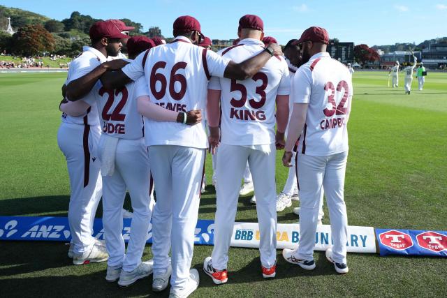 The West Indies' players prepare to walk onto the field at the start of the New Zealand innings during day one of the 2nd international Test cricket match between New Zealand and West Indies at the Basin reserve in Wellington on December 10, 2025. (Photo by Marty MELVILLE / AFP)