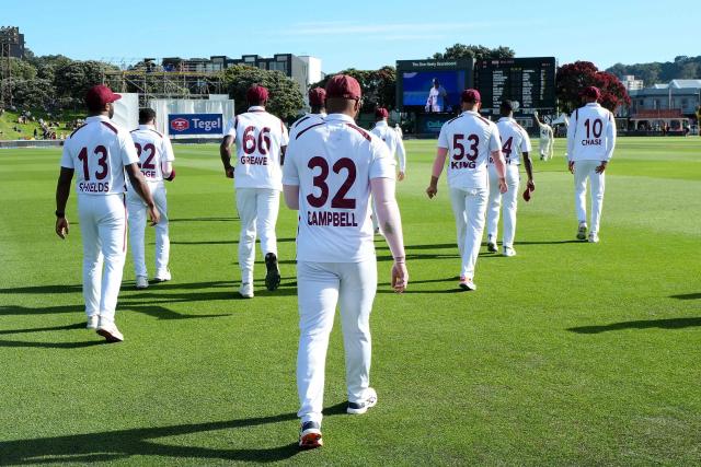 The West Indies' players walk onto the field at the start of the New Zealand innings during day one of the 2nd international Test cricket match between New Zealand and West Indies at the Basin reserve in Wellington on December 10, 2025. (Photo by Marty MELVILLE / AFP)