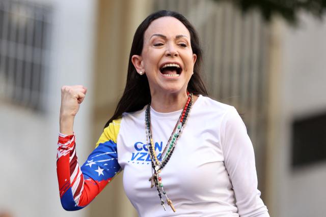 TOPSHOT - (FILES) Venezuelan opposition leader Maria Corina Machado gestures as she addresses her supporters during a protest called by the opposition on the eve of the presidential inauguration in Caracas on January 9, 2025. The director of the Nobel institute said on December 10, 2025, he was not aware where Venezuelan opposition leader Maria Corina Machado was after it was announced she would not attend the award of her Nobel Peace Prize. (Photo by Pedro MATTEY / AFP)