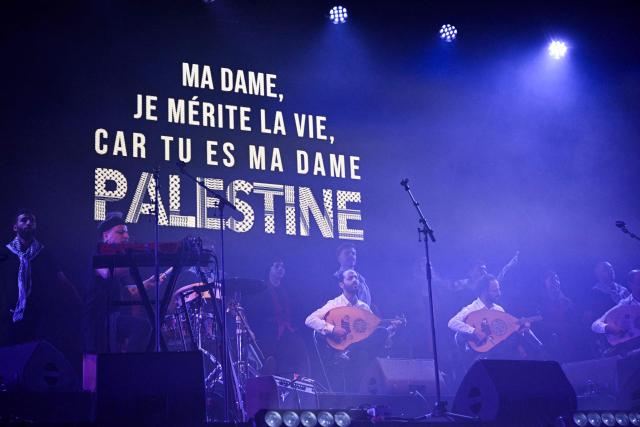 Palestinian music band "Le Trio Joubran" performs on stage during the "Together for Palestine" benefit concert at the Zenith Paris event venue, in Paris on December 9, 2025. (Photo by Anna KURTH / AFP)