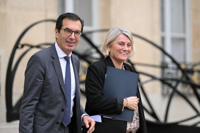 France's Labour Minister Jean-Pierre Farandou and France's Health Minister Stephanie Rist leave the Elysee Palace after the weekly cabinet meeting, in Paris on December 10, 2025. (Photo by Bertrand GUAY / AFP)