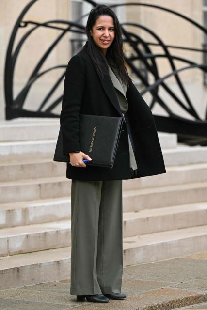 France's Overseas Minister Naima Moutchou leaves the Elysee Palace after the weekly cabinet meeting, in Paris on December 10, 2025. (Photo by Bertrand GUAY / AFP)