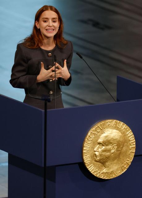 Ana Corina Sosa, daughter of Venezuelan opposition leader Maria Corina Machado, speaks after receiving the Nobel Peace Prize for her mother at the Nobel Peace Prize ceremony at Oslo City Hall on December 10, 2025 in Oslo, Norway. The 2025 Nobel Peace Prize was awarded to Machado for her efforts to bring democracy to Venezuela, challenging the iron-fisted rule of Venezuelan President Nicolas Maduro, who has been president since 2013. (Photo by Odd ANDERSEN / AFP)