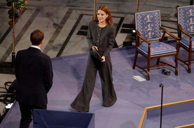 Ana Corina Sosa (R), daughter of Venezuelan opposition leader Maria Corina Machado, steps up to speak after receiving the Nobel Peace Prize for her mother from the Chair of the Norwegian Nobel Committee Jorgen Watne Frydnes (L) at the Nobel Peace Prize ceremony at Oslo City Hall on December 10, 2025 in Oslo, Norway. The 2025 Nobel Peace Prize was awarded to Machado for her efforts to bring democracy to Venezuela, challenging the iron-fisted rule of Venezuelan President Nicolas Maduro, who has been president since 2013. (Photo by Odd ANDERSEN / AFP)